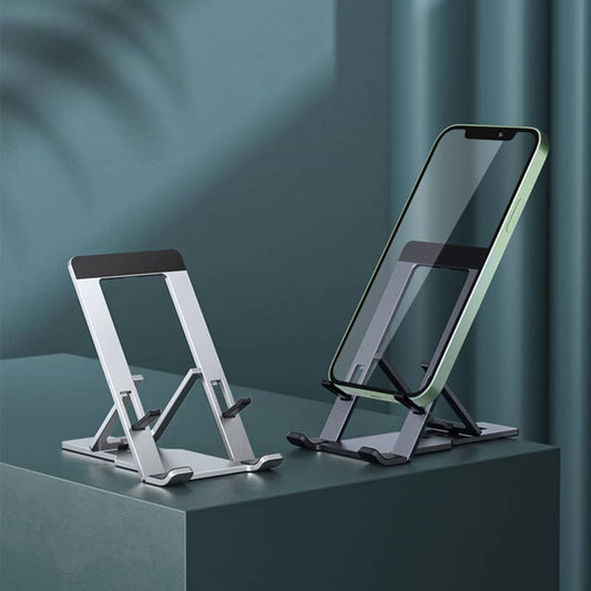adjustable aluminium tablet stand in silver holding a smartphone on a grey surface